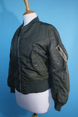 Women's or men's vintage army bomber jacket. Cropped and reversible in a Nylon material. One side is army green and one side in orange.