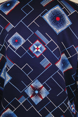 Men's vintage 1970's Da Vinci Presents Delfina label long sleeve vibrant navy blue button up shirt with all over white and red abstract print in thick polyester material.