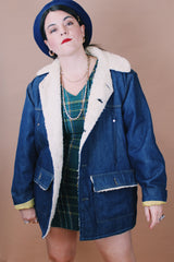 Men's or women's vintage 1970's Montgomery Ward label size medium long sleeve dark wash denim jacket with cream colored shearling liner.