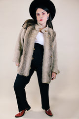 Women's vintage 1980's Lifestyle 80's by Andrea Ungar label long sleeve jacket with faux fur body in front and back and acrylic arms. Buttons up the front with side pockets.