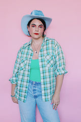 Men's or women's vintage 1970's JCPenney label long sleeve button up shirt in a white, green, and blue plaid print. Clear buttons, two chest pockets.