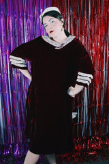 Women's vintage 1960's long sleeve knee length maroon red velvet dress. Has a rounded peter pan collar with white lace trim