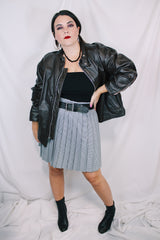 Men's or women's vintage 1980's Kirk's Suede Life label long sleeve oversized dark chocolate brown leather bomber jacket with zipper front closure.