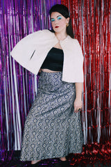 Women's vintage 1970's maxi length navy blue skirt. Skirt has an all over silver and gold embroidered metallic pattern.