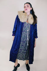 Women's vintage 1960's long sleeve purple satin robe. Long length and shiny material. Chest pocket and two side pockets.