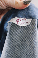 Women's vintage 1970's By Bogat of Texas long sleeve button up medium wash denim chambray top with red and white contrast stitching.