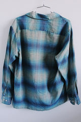 Men's or women's vintage 1960's Sears label long sleeve button plaid shirt in blue and grey colors. One left chest pocket.