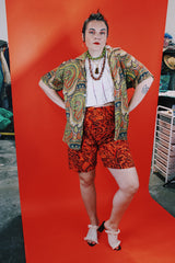 Women's or men's vintage 1960's Don Soper of California label short sleeve button up shirt with collar. All over paisley print in green, yellow, and orange.