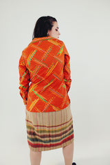 vintage bright orange long sleeve button up blouse with collar green, white, and light orange print back