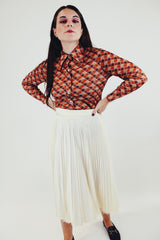 vintage printed long sleeve button up blouse with pointy collar in various brown tones front