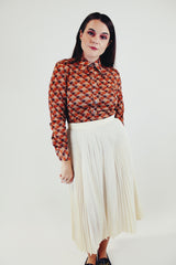 vintage printed long sleeve button up blouse with pointy collar in various brown tones front