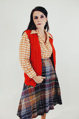 Vintage Orange button up vest with two front pockets and knitted braiding side