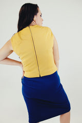 vintage three piece knit set with blue cropped jacket, midi skirt, and sleeveless embroidered top back without jacket