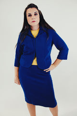 vintage three piece knit set with blue cropped jacket, midi skirt, and sleeveless embroidered top front