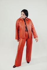 vintage pleather two piece set in burnt orange includes button up collared jacket and high waist pants front