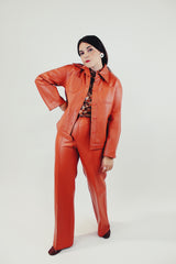 vintage pleather two piece set in burnt orange includes button up collared jacket and high waist pants front