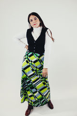 vintage long sleeve maxi dress with mock neck and attached black vest skirt bottom has green grey and black print front