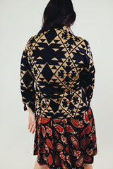 vintage long sleeve button up blouse with black and tan print and pointy collar back