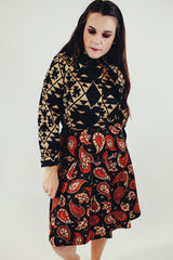 vintage long sleeve button up blouse with black and tan print and pointy collar front