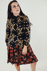 vintage long sleeve button up blouse with black and tan print and pointy collar front