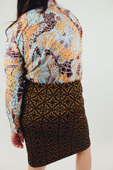 vintage long sleeve button up blouse with brown blue and orange print back