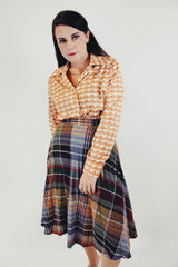 Vintage cream and orange floral printed long sleeve button up blouse front tucked in