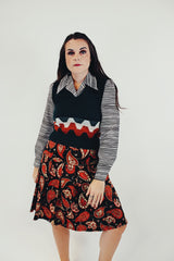 forest green vintage women's acrylic sweater vest with orange and white stripe detail front