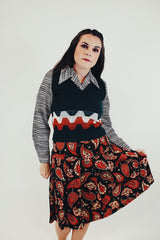 forest green vintage women's acrylic sweater vest with orange and white stripe detail front