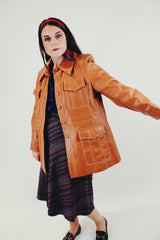 Vintage camel colored pleather jacket with four front pocket side open