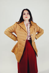 women's brown quilted puffer jacket double lapel front pockets hits above the knee front