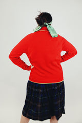 long red sweater with half buttons and collar