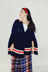 women's vintage navy crochet poncho with red and white stripes around hem with buttons and collar front