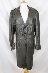 Men's or women's vintage 1970's Made in Argentina label knee length dark grey colored leather trench coat with double lapel and button closure.