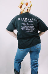 Women's or men's vintage 1997 Gildan Heavyweight, Made in Canada label short sleeve black The Kinks' Ray Davies The Storyteller tour tee with colored graphic and text on front and back.