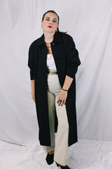 Women's vintage 1990's Nordstrom - Point of View label long sleeve long length black trench coat in a wool material. Fully lined, side pockets, back slit, and shoulder pads.