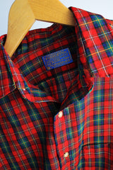 Men's or women's vintage 1980's Pendleton label long sleeve button up shirt in an all over red plaid print. Lightweight wool material, tortoise buttons.