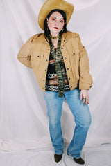 Men's or women's vintage tan colored long sleeve suede jacket by JCPenney. Popper buttons and contrast stitching and fully lined.