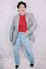 Men's or women's vintage 1970's Designed by Oleg Cassini label long sleeve light grey colored blazer with button closure and front pockets.