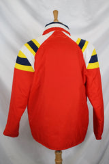 Men's or women's vintage 1980's JCPenney, Made in Hong Kong label long sleeve zip up puffy jacket in nylon material and red, blue, white, and yellow colors.