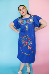 Women's vintage 1970's short sleeve bright blue cotton dress with all over multicolored floral and parrot print embroidery