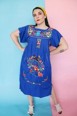 Women's vintage 1970's short sleeve bright blue cotton dress with all over multicolored floral and parrot print embroidery