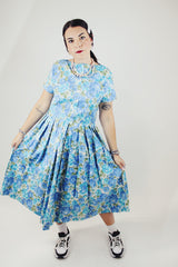 short sleeve blue floral print midi length dress with a line structure women's vintage 1960's