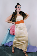 Women's vintage 1960's sleeveless ankle length dress in a cream off white with metallic gold floral print all over