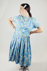 short sleeve blue floral print midi length dress with a line structure women's vintage 1960's