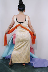 Women's vintage 1960's sleeveless ankle length dress in a cream off white with metallic gold floral print all over