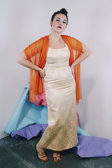 Women's vintage 1960's sleeveless ankle length dress in a cream off white with metallic gold floral print all over