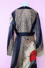 Women's vintage 1970's Tori Richard Honolulu for Liberty House, Made in USA label long sleeve maxi length polyester material all over printed dress with deep V shaped neckline.