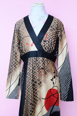 Women's vintage 1970's Tori Richard Honolulu for Liberty House, Made in USA label long sleeve maxi length polyester material all over printed dress with deep V shaped neckline.