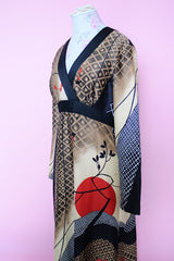 Women's vintage 1970's Tori Richard Honolulu for Liberty House, Made in USA label long sleeve maxi length polyester material all over printed dress with deep V shaped neckline.