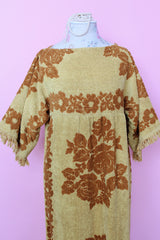Women's vintage 1970's Fashion Manor, Decorator Collection label short sleeve ankle length dress in a mustard yellow and brown floral print cotton towel material.